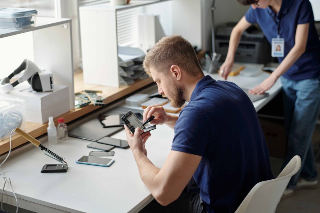 Young worker of technical repair office